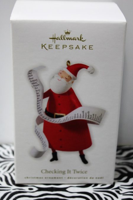 Santa "Checking It Twice" Naughty and Nice list in a Hallmark ornament